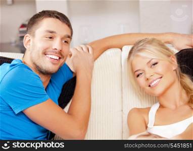 bright picture of happy couple at home (focus on man)