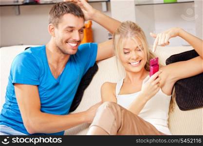 bright picture of happy couple with cellphone