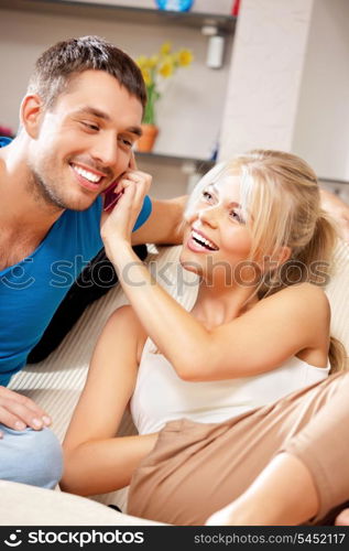 bright picture of happy couple with cellphone