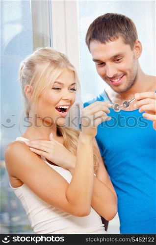 bright picture of happy couple with keys