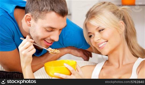 bright picture of happy couple with muesli, focus on woman