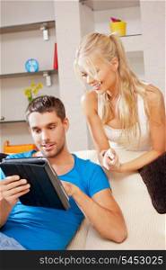 bright picture of happy couple with tablet PC