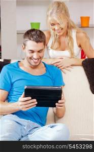 bright picture of happy couple with tablet PC