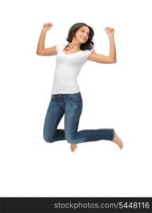 bright picture of happy jumping woman in blank white t-shirt.