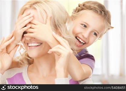 bright picture of happy mother and little girl