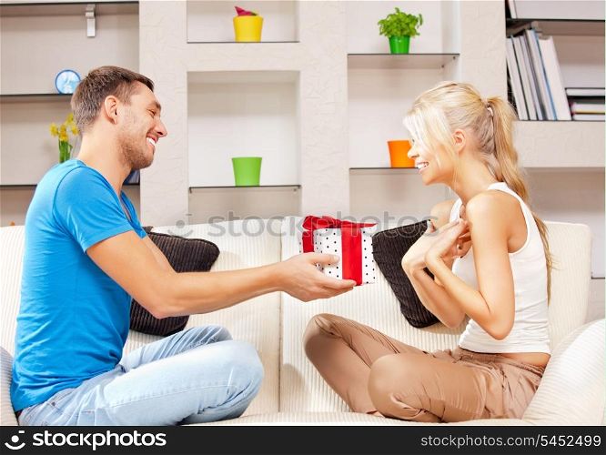 bright picture of happy romantic couple with gift