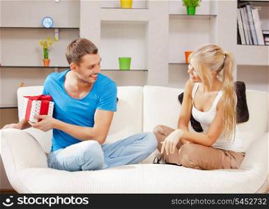 bright picture of happy romantic couple with gift