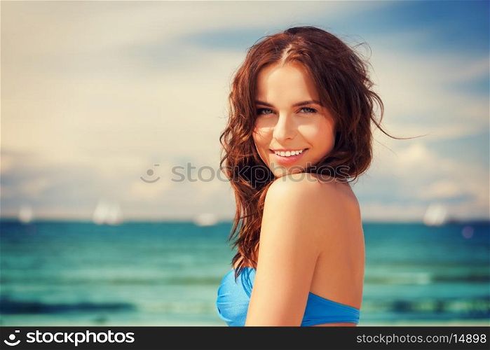 bright picture of happy smiling woman on the beach