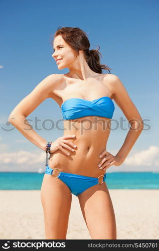 bright picture of happy smiling woman on the beach.