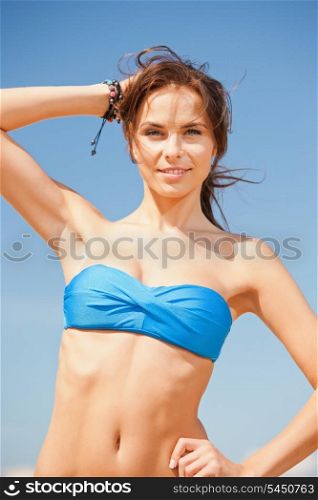 bright picture of happy smiling woman on the beach.