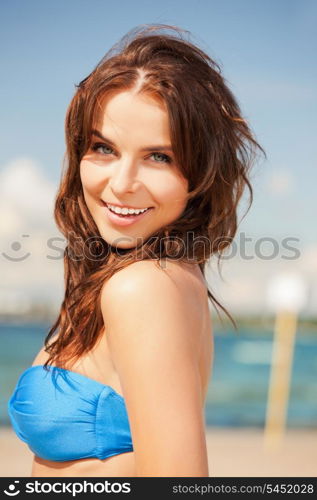 bright picture of happy smiling woman on the beach.