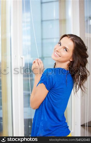 bright picture of happy woman at the window