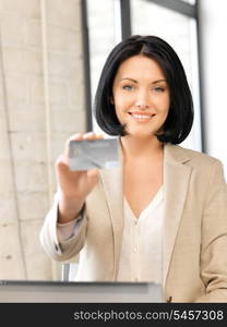 bright picture of happy woman with credit card