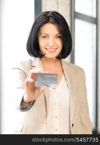 bright picture of happy woman with credit card