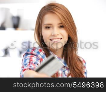 bright picture of happy woman with credit card