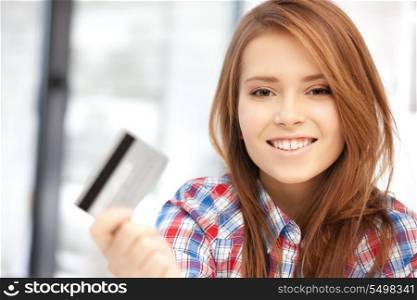 bright picture of happy woman with credit card