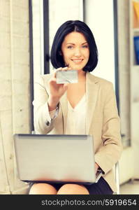 bright picture of happy woman with credit card. happy woman with credit card