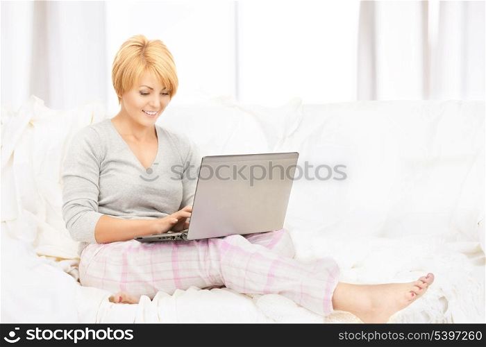 bright picture of happy woman with laptop computer.