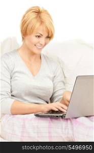 bright picture of happy woman with laptop computer&#xA;