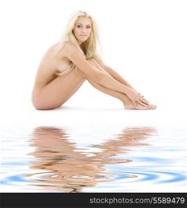 bright picture of healthy naked blonde on white sand
