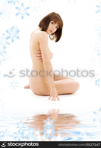bright picture of healthy naked brunette with snowflakes