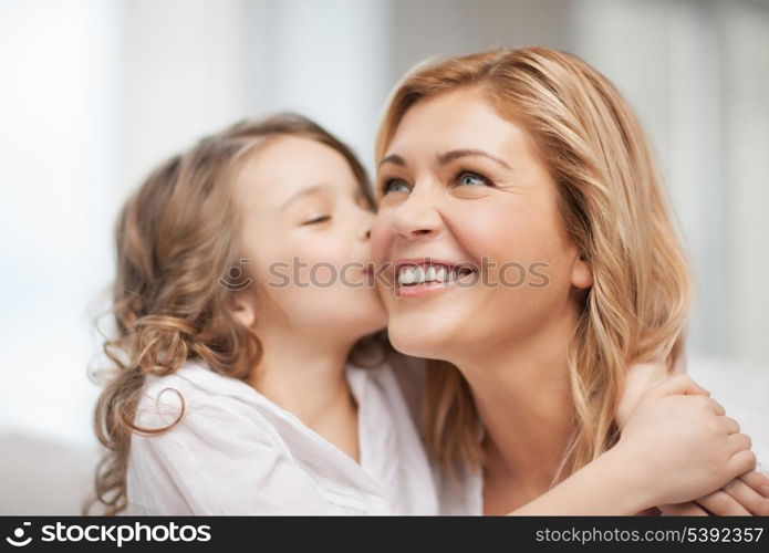 bright picture of hugging mother and daughter