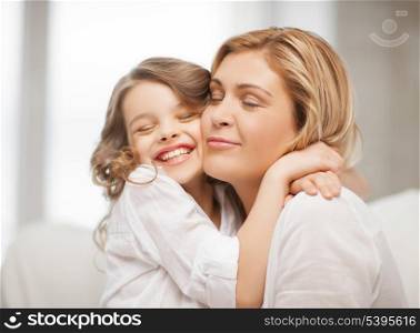 bright picture of hugging mother and daughter