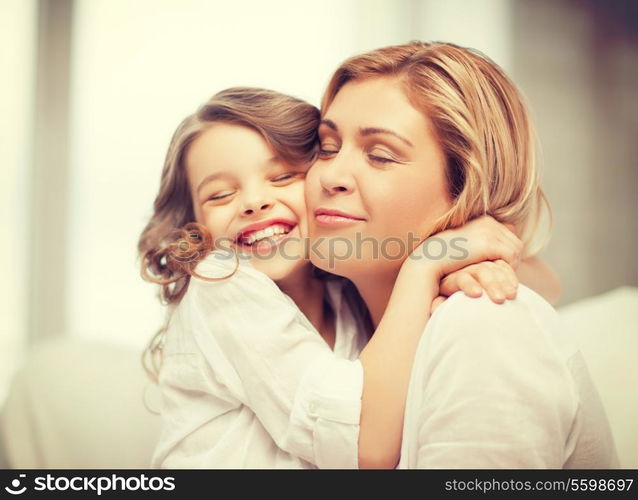 bright picture of hugging mother and daughter