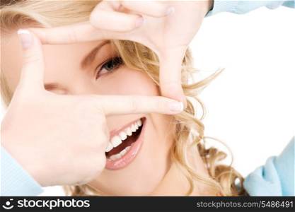 bright picture of lovely blonde creating a frame with fingers