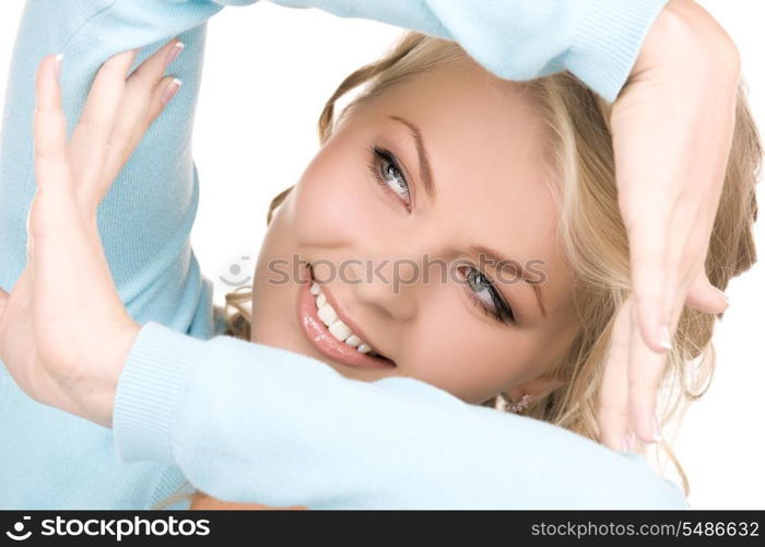 bright picture of lovely blonde creating a frame with hands