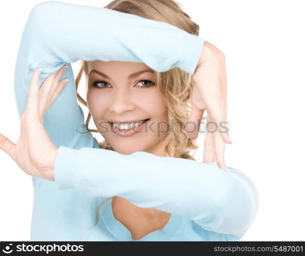 bright picture of lovely blonde creating a frame with hands