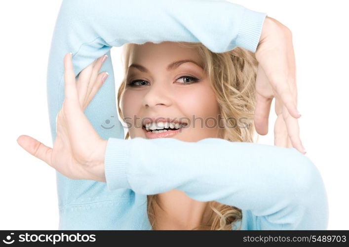 bright picture of lovely blonde creating a frame with hands