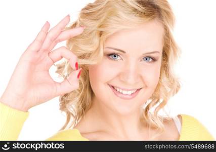 bright picture of lovely blonde showing ok sign