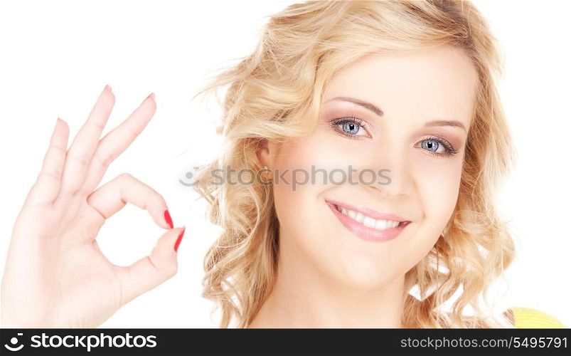 bright picture of lovely blonde showing ok sign