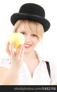 bright picture of lovely blonde with green apple (focus on hand)