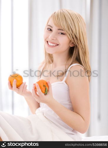 bright picture of lovely blonde with oranges