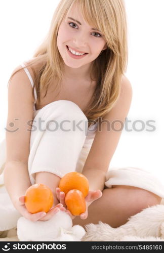 bright picture of lovely blonde with oranges