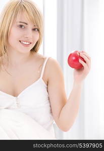 bright picture of lovely blonde with red apple