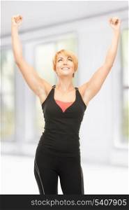 bright picture of lovely fit woman with expression of triumph