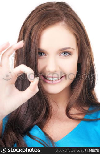 bright picture of lovely girl showing ok sign