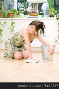 bright picture of lovely housewife cleaning floor