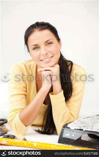bright picture of lovely housewife making repairing works