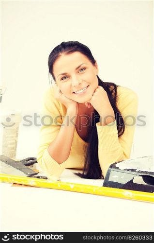 bright picture of lovely housewife making repairing works. lovely housewife making repairing works