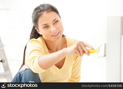 bright picture of lovely housewife painting at home