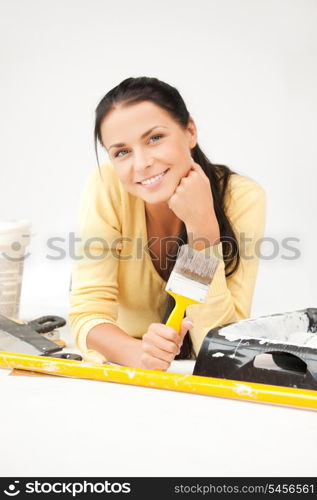 bright picture of lovely housewife painting at home