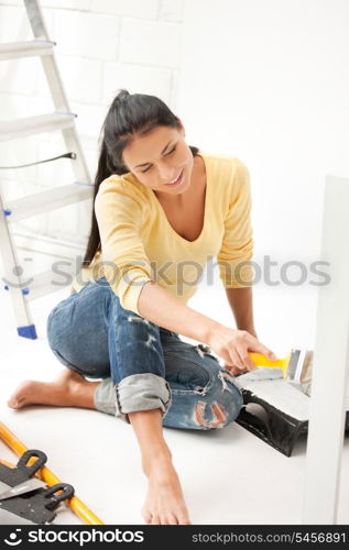 bright picture of lovely housewife painting at home