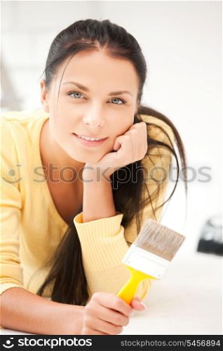 bright picture of lovely housewife painting at home