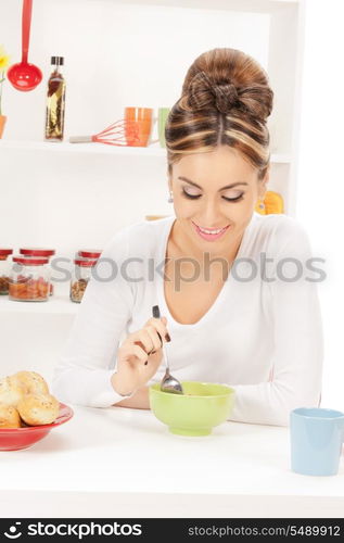 bright picture of lovely housewife with cup of muesli