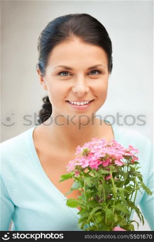 bright picture of lovely housewife with flower