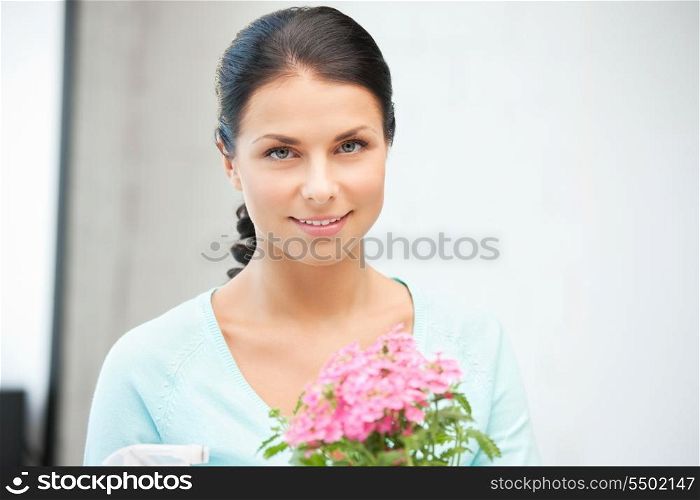 bright picture of lovely housewife with flower.